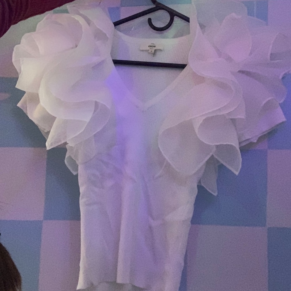 White V-neck t-shirt with flowery sleeves.